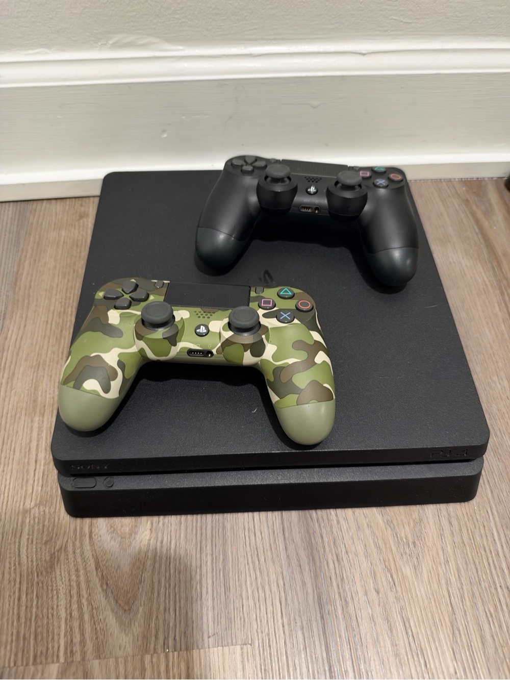 Sony PlayStation Slim Console with Black and Green Camo DualShock Controllers